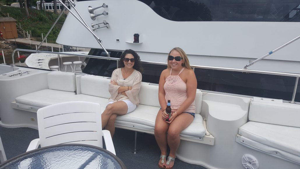 Two women sitting on a boat