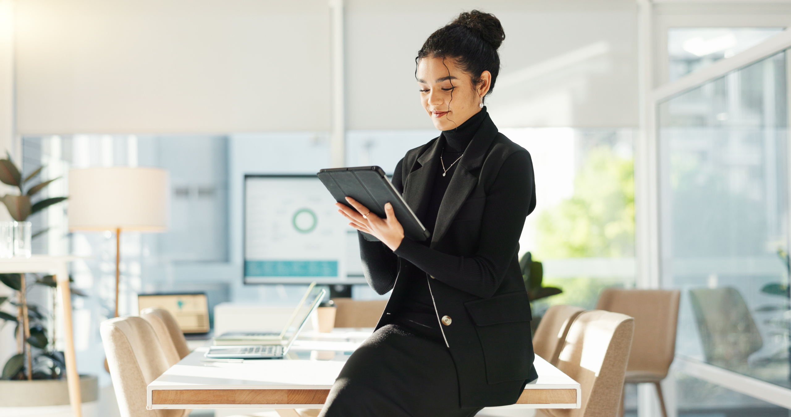 Happy woman in office with tablet, email or social media review for tech business, schedule or agenda. Smile, digital app and businesswoman networking online for market research, website and report.